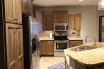 Fully equipped kitchen w/granite counter tops & breakfast bar